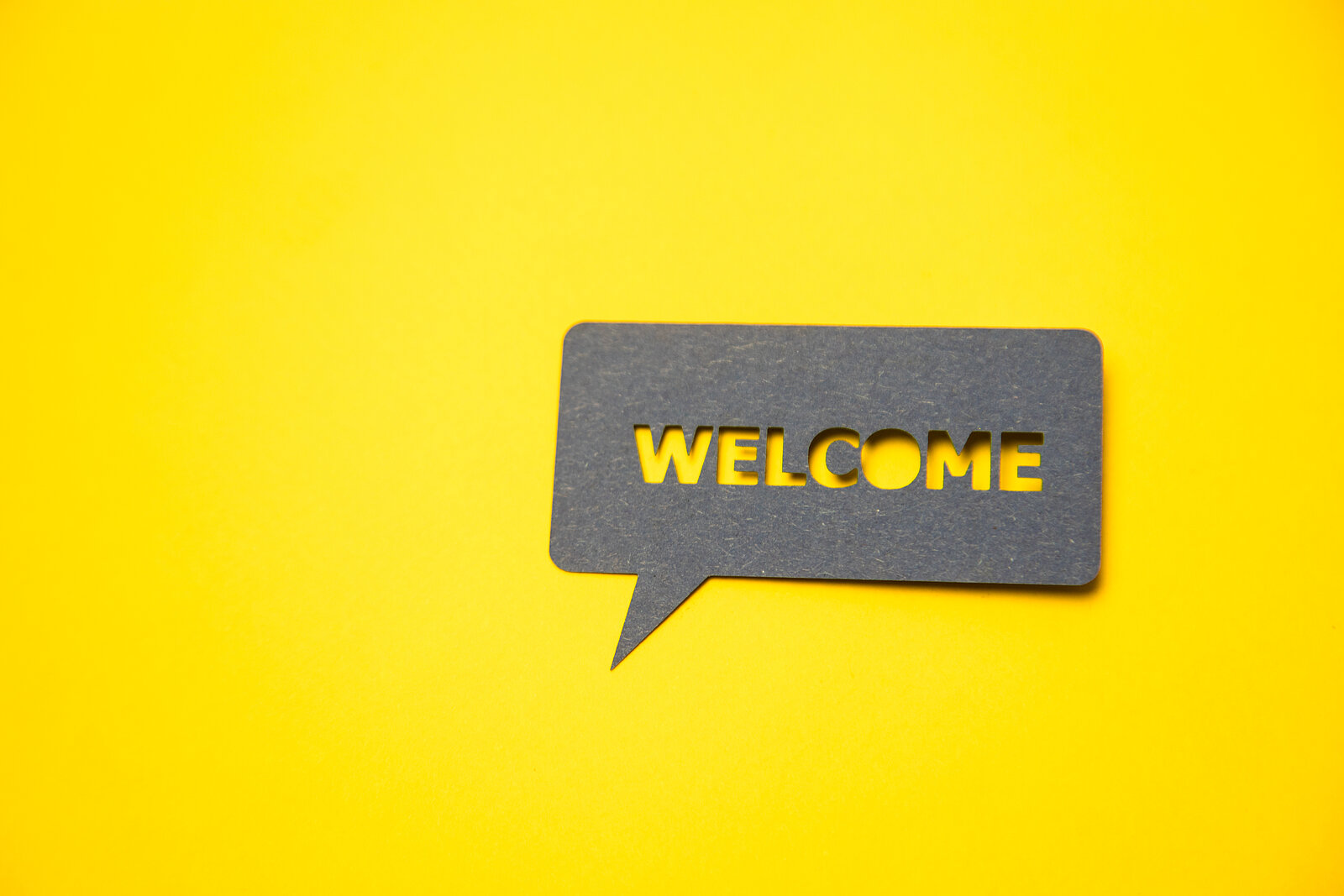Image of a speech bubble that says Welcome
