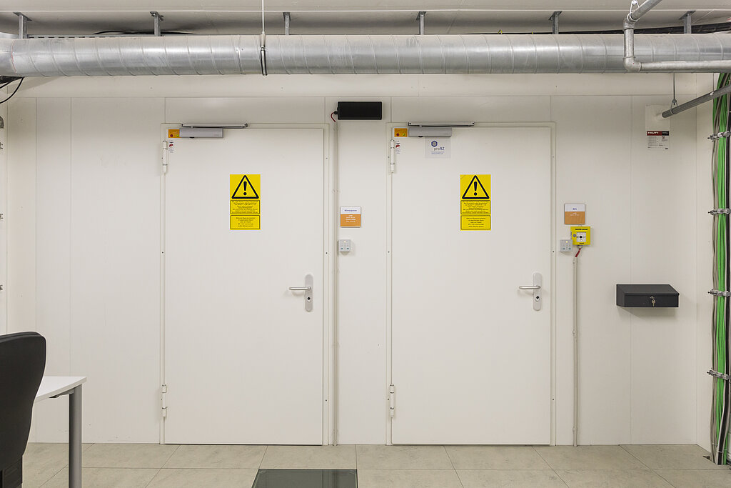 2 security doors side by side with tube above