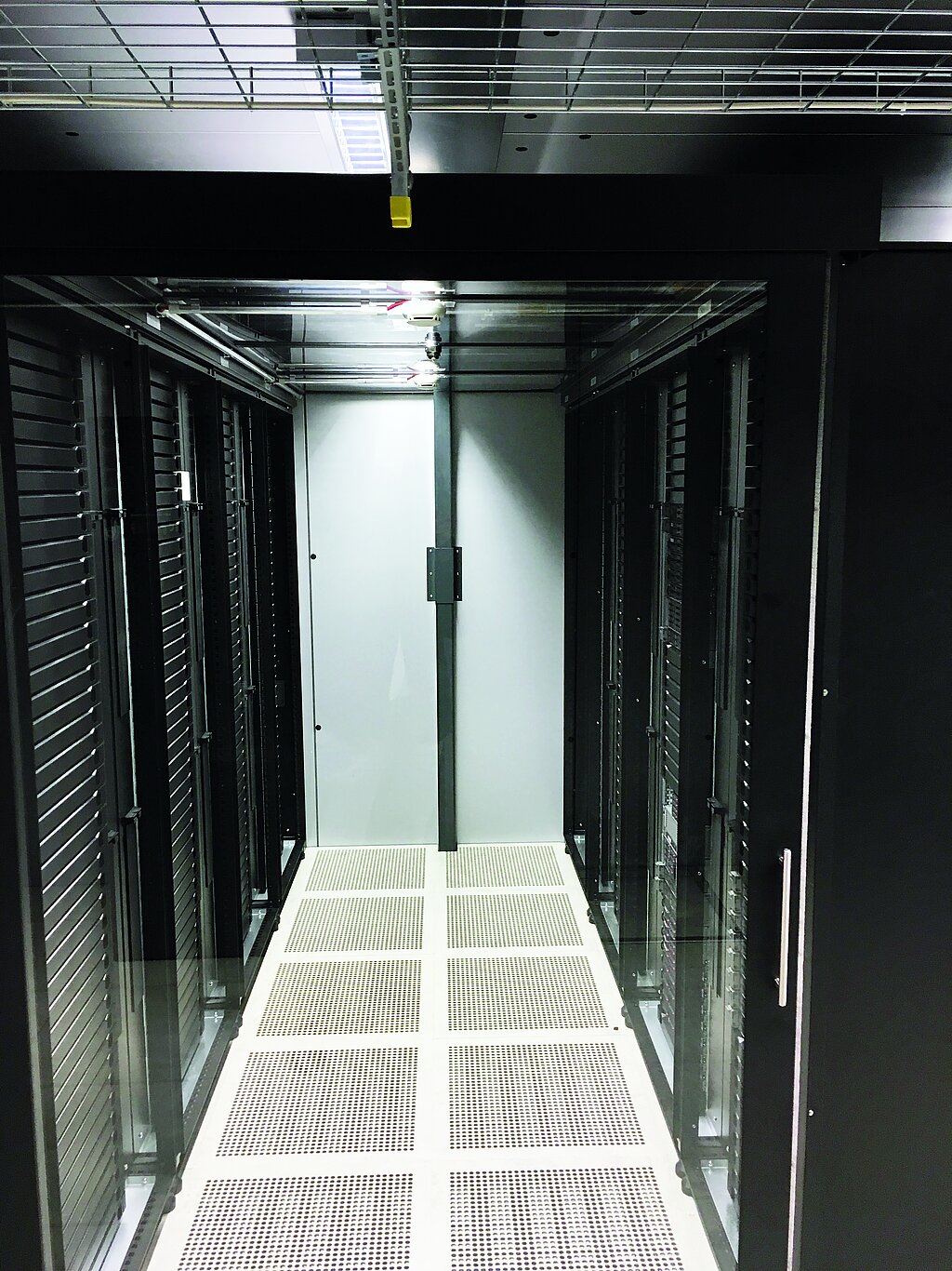Server aisle with black cabinets left and right