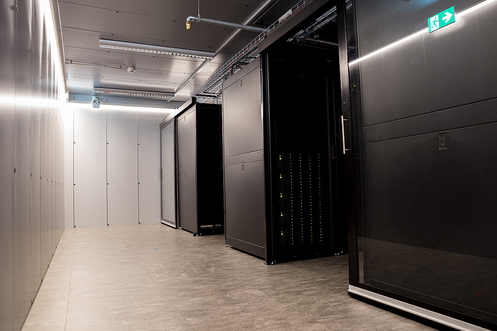 The data room in the data center with server aisles, lighting and fire extinguishing system