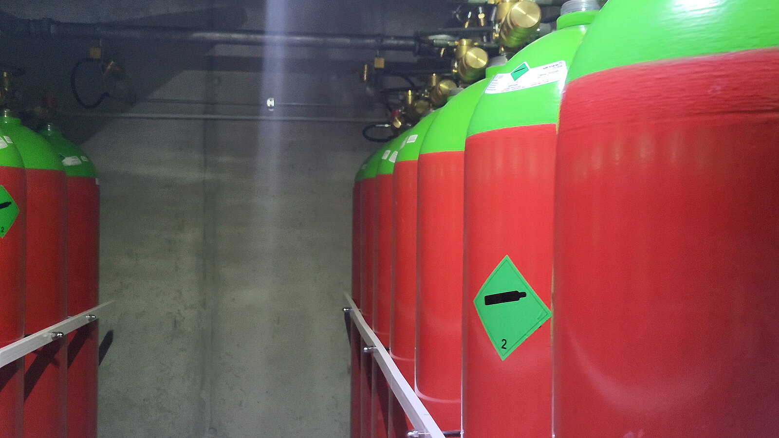 Red fire extinguishers containing extinguishing agents