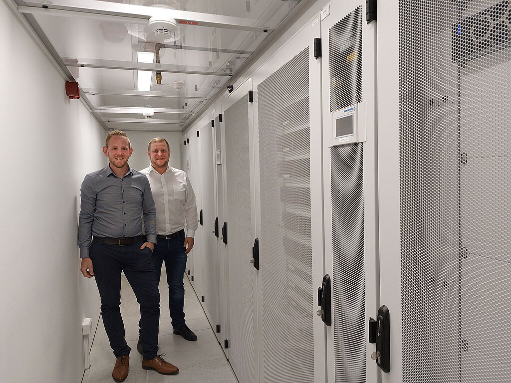 Benjamin Uhr (Head of Infrastructure, Service and Support, Best4Tires) with Florian Hammer (Area Sales Manager, Data Center Group) in front of the Data Center
