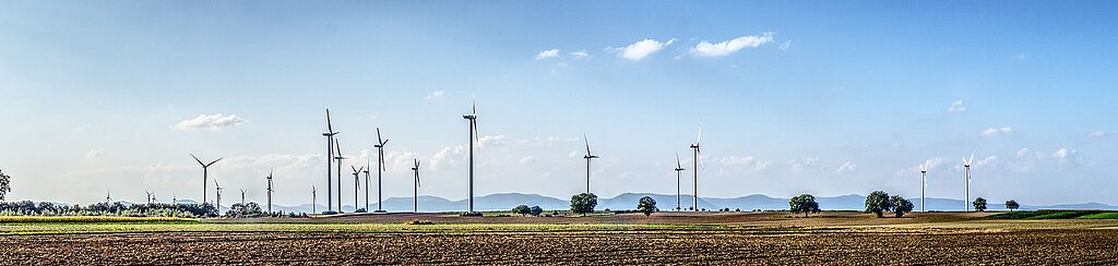 various wind turbines on a field