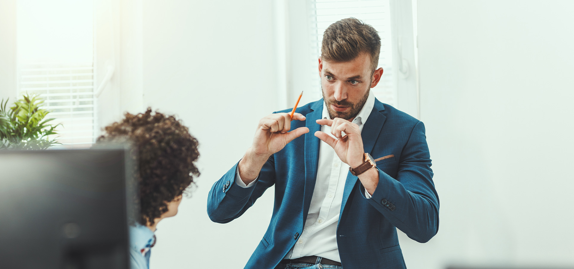 A man explains something with his hands.