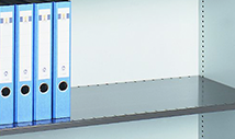 Shelf of the safe with 4 light blue folders on the left