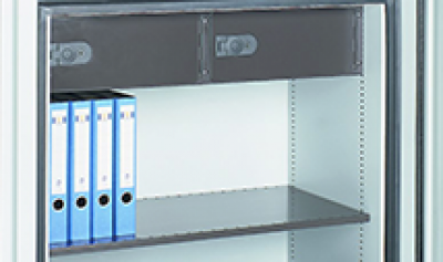 Inner compartment of a safe, 4 light blue folders on the left side