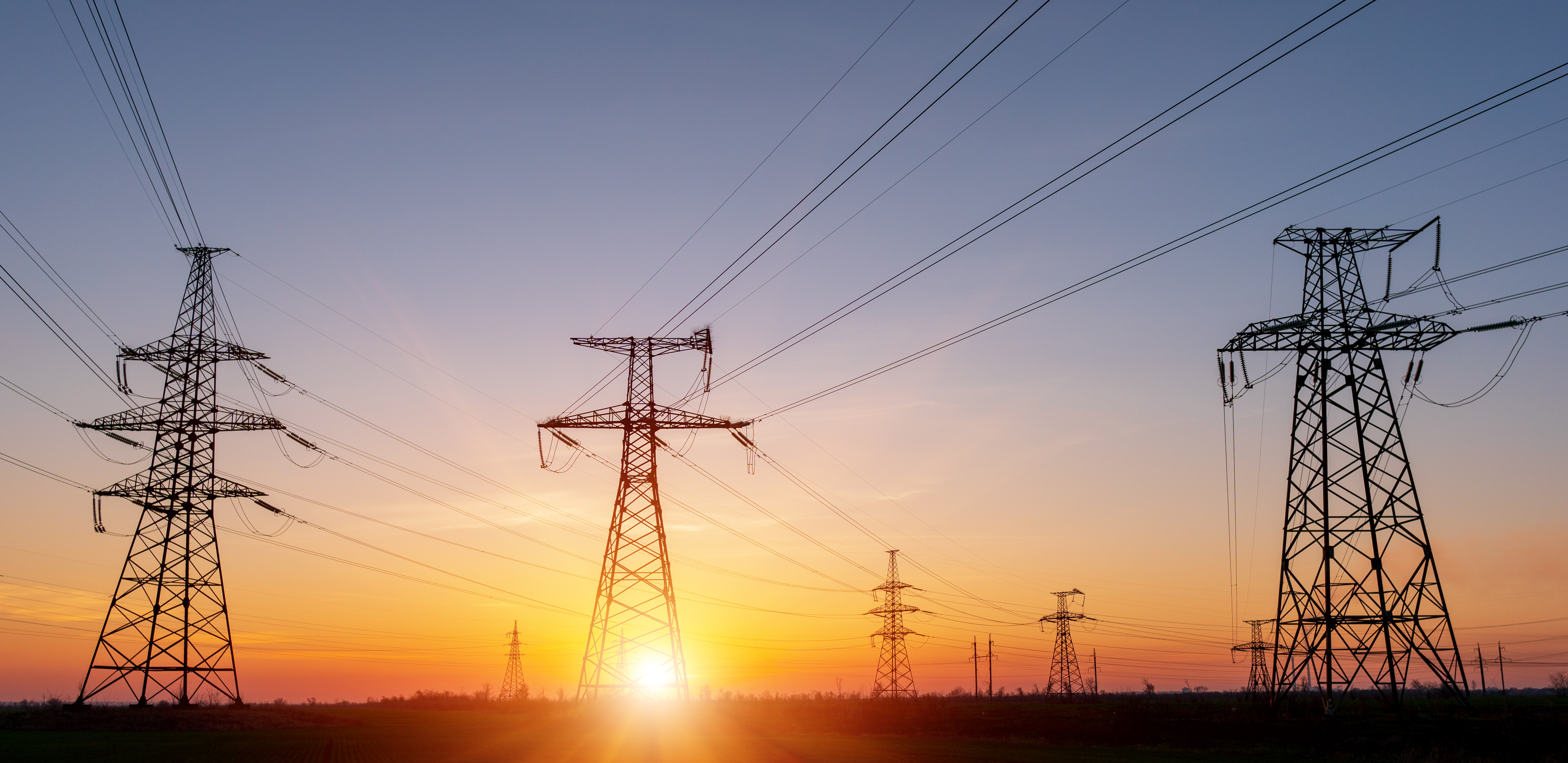 Power poles in sunset
