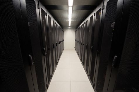 Server aisle between 2 black data center containers