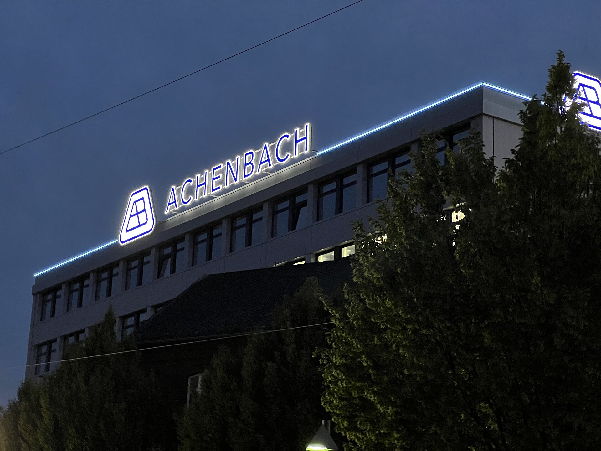 Achenbach Buschhütten company building with illuminated lettering